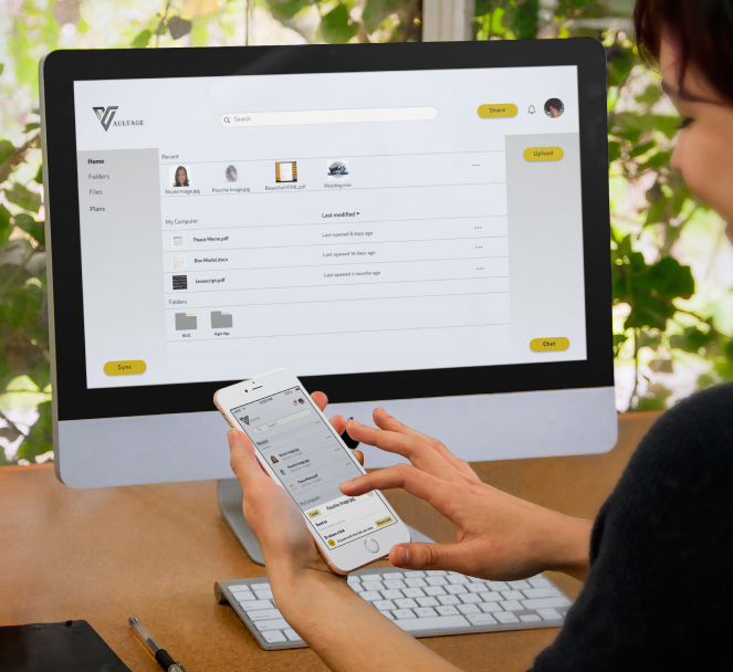 A woman using a computer and a phone mockups showcasing the Vaultage app user interface